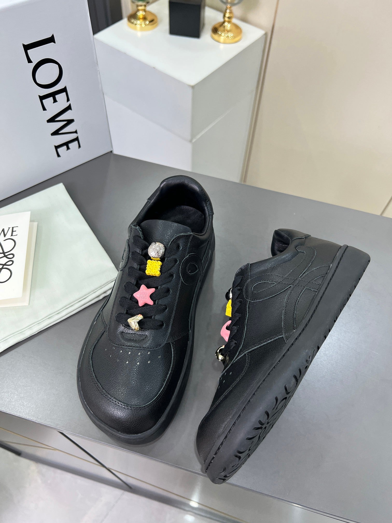 LOEWE 26S LOW TOP SNEAKERS IN BLACK CALFSKIN WITH CHARM LACES