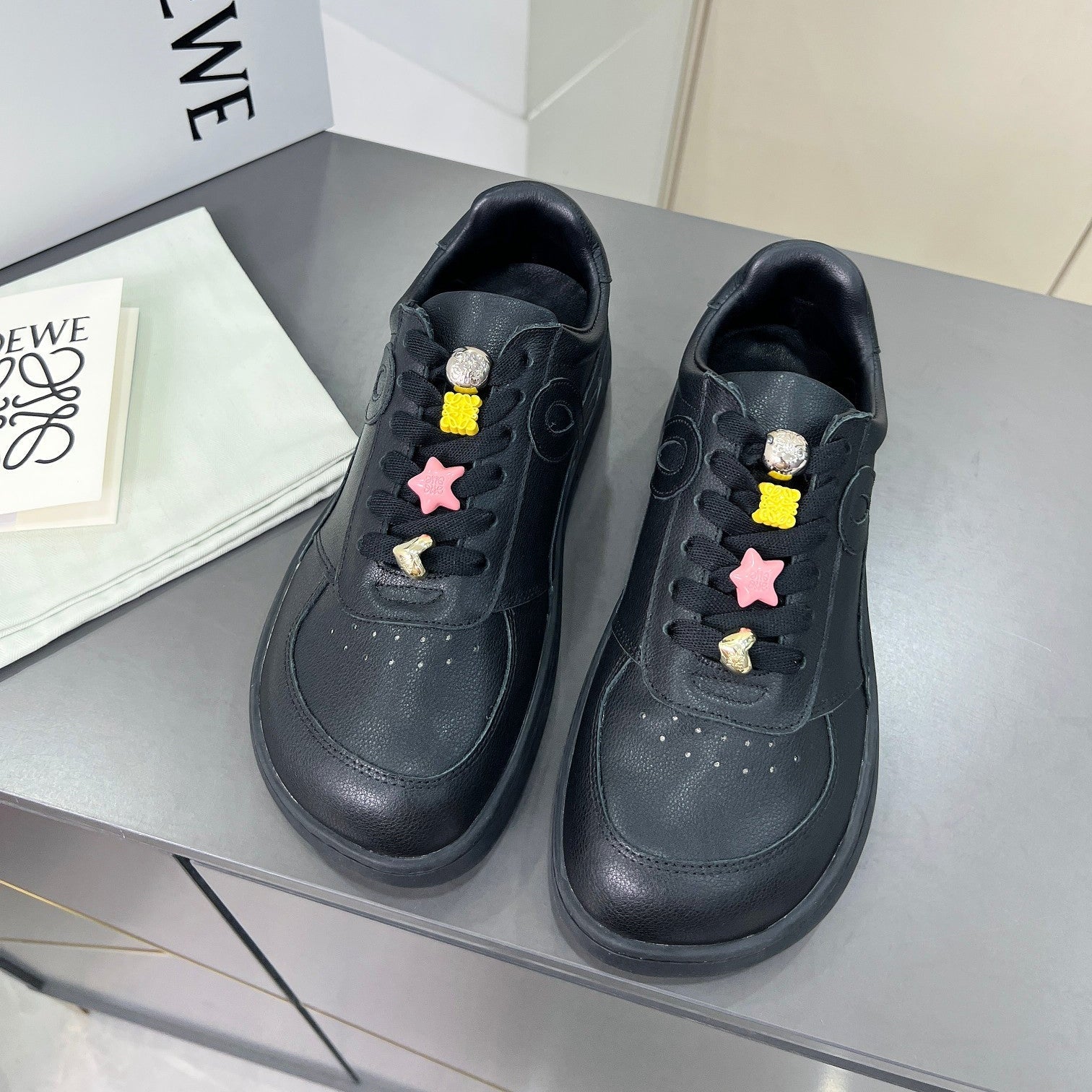 LOEWE 26S LOW TOP SNEAKERS IN BLACK CALFSKIN WITH CHARM LACES