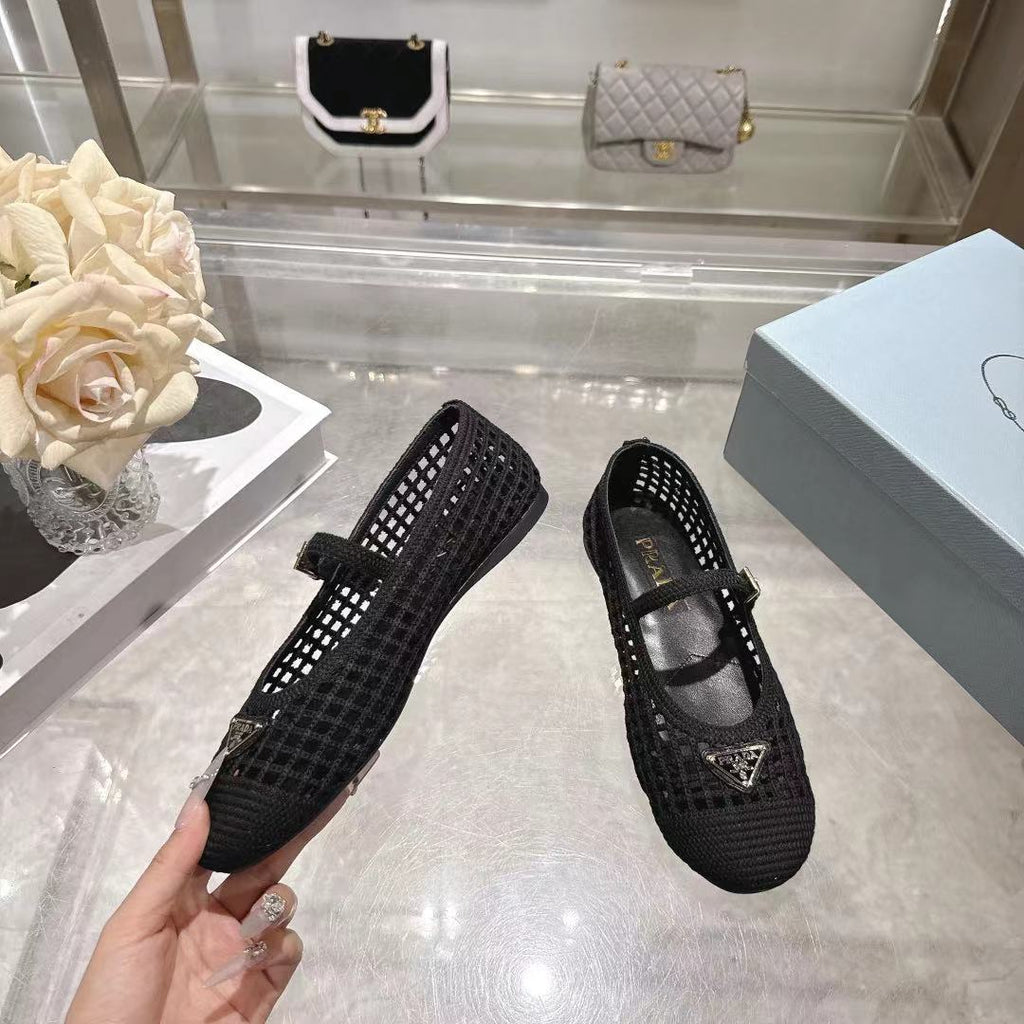 PRADA 26S LOGO PLAQUE MARY JANE FLATS IN BLACK WOVEN FIBER