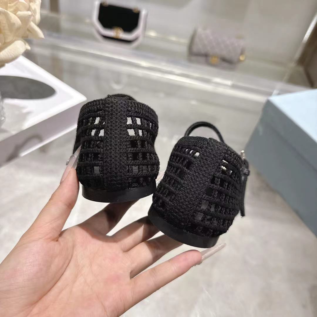PRADA 26S LOGO PLAQUE MARY JANE FLATS IN BLACK WOVEN FIBER