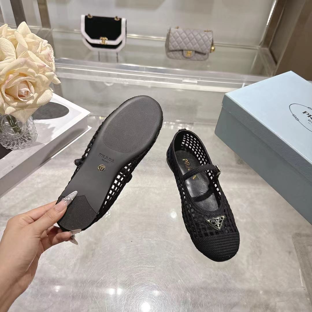 PRADA 26S LOGO PLAQUE MARY JANE FLATS IN BLACK WOVEN FIBER
