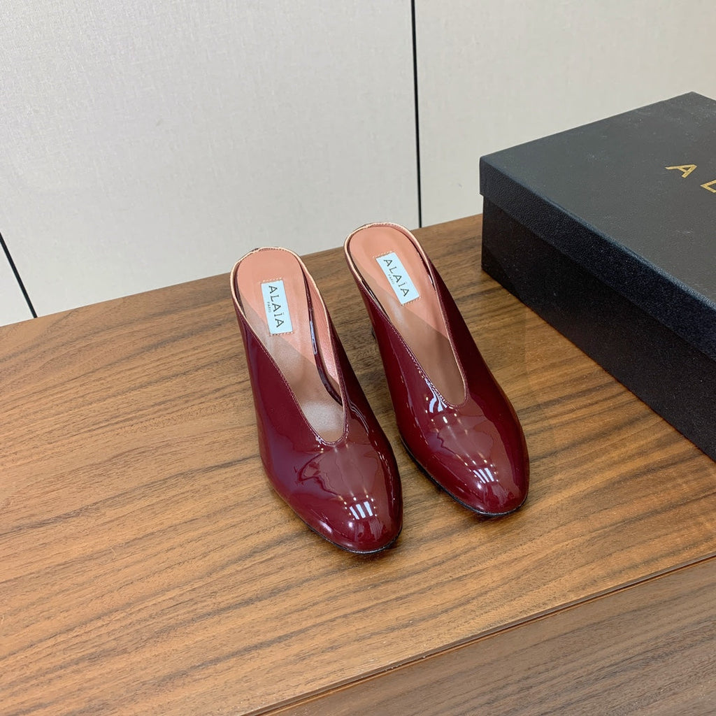 ALAIA 26S WEDGE MULES 70 MM IN DARK RED GLOSSY CALFSKIN