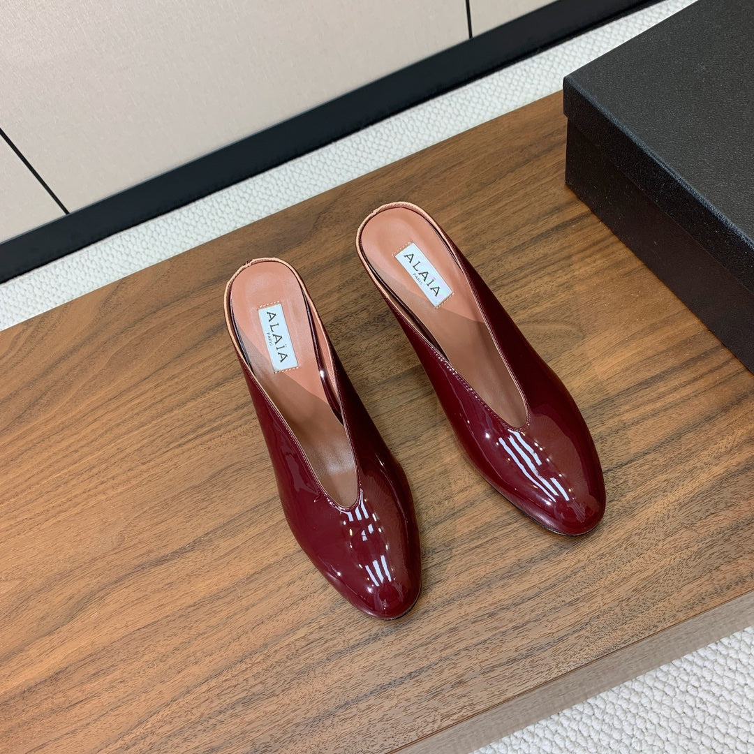 ALAIA 26S WEDGE MULES 70 MM IN DARK RED GLOSSY CALFSKIN