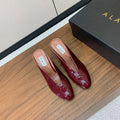 ALAIA 26S WEDGE MULES 70 MM IN DARK RED GLOSSY CALFSKIN
