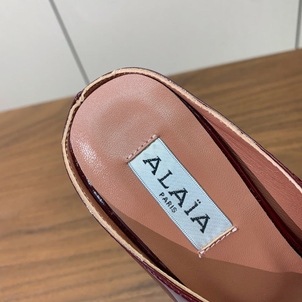 ALAIA 26S WEDGE MULES 70 MM IN DARK RED GLOSSY CALFSKIN