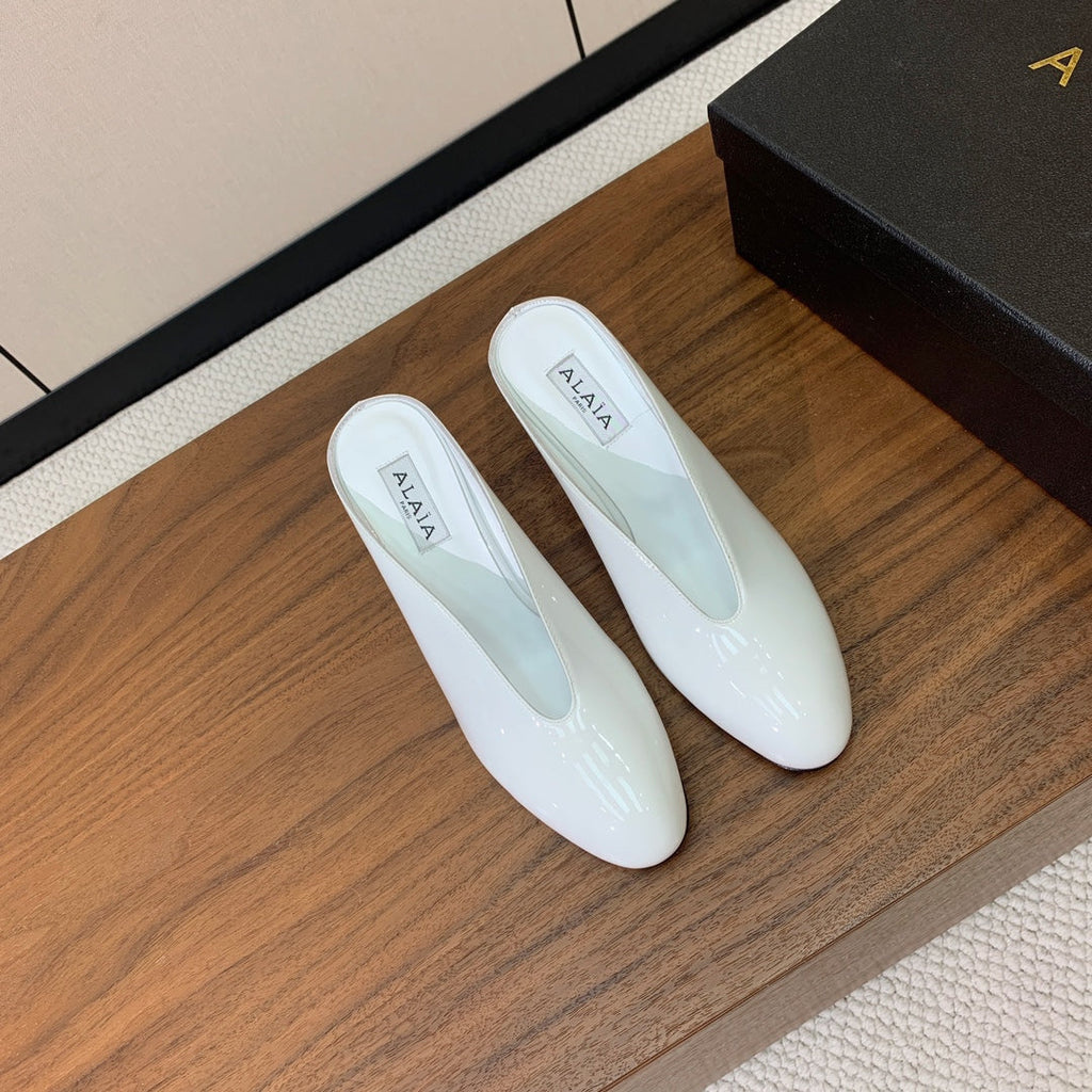 ALAIA 26S WEDGE MULES 70 MM IN WHITE GLOSSY CALFSKIN