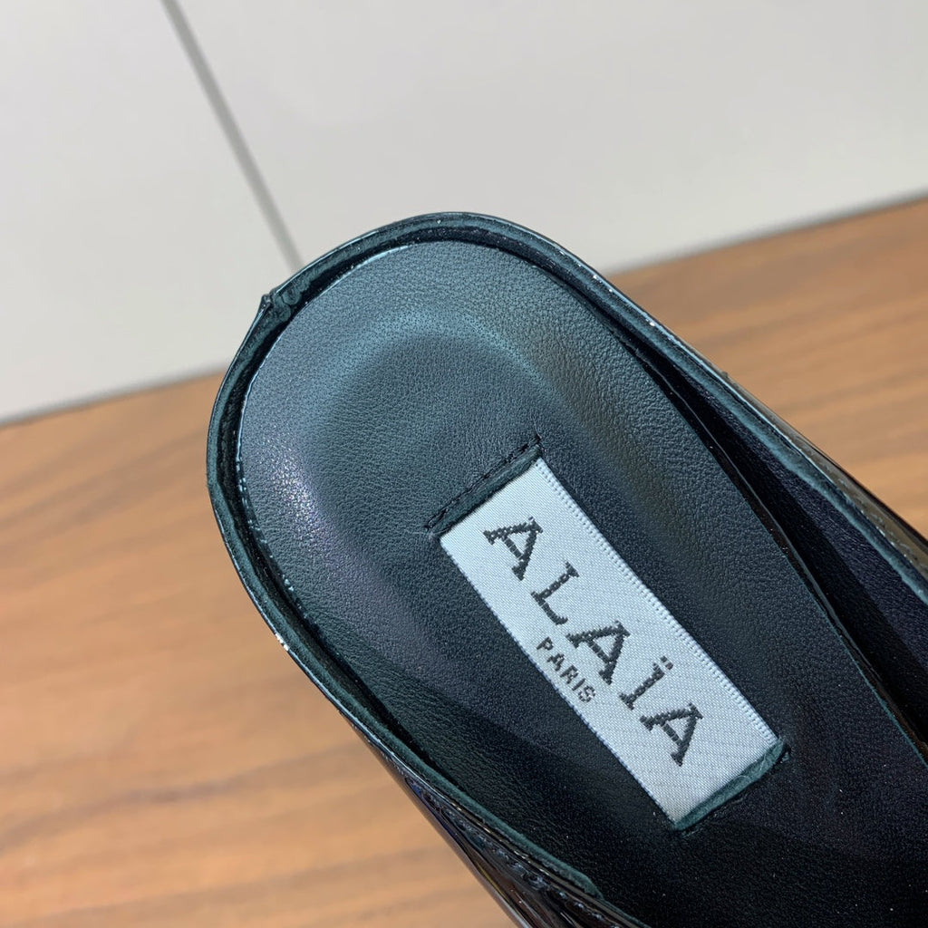 ALAIA 26S WEDGE MULES 70 MM IN BLACK GLOSSY CALFSKIN