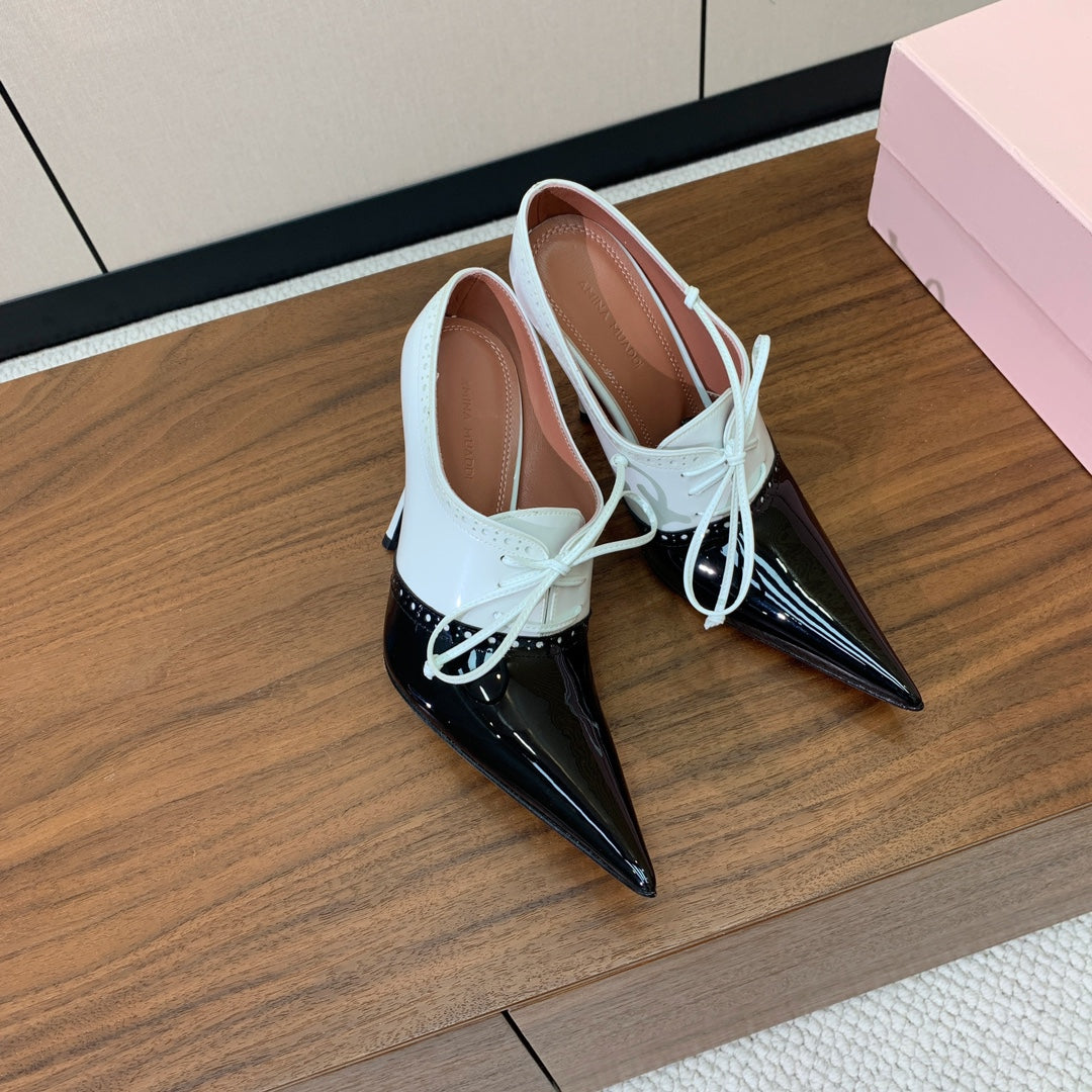 ALAIA 26S LACE-UP HEELED 105 MM IN BLACK AND WHITE GLOSSY CALFSKIN