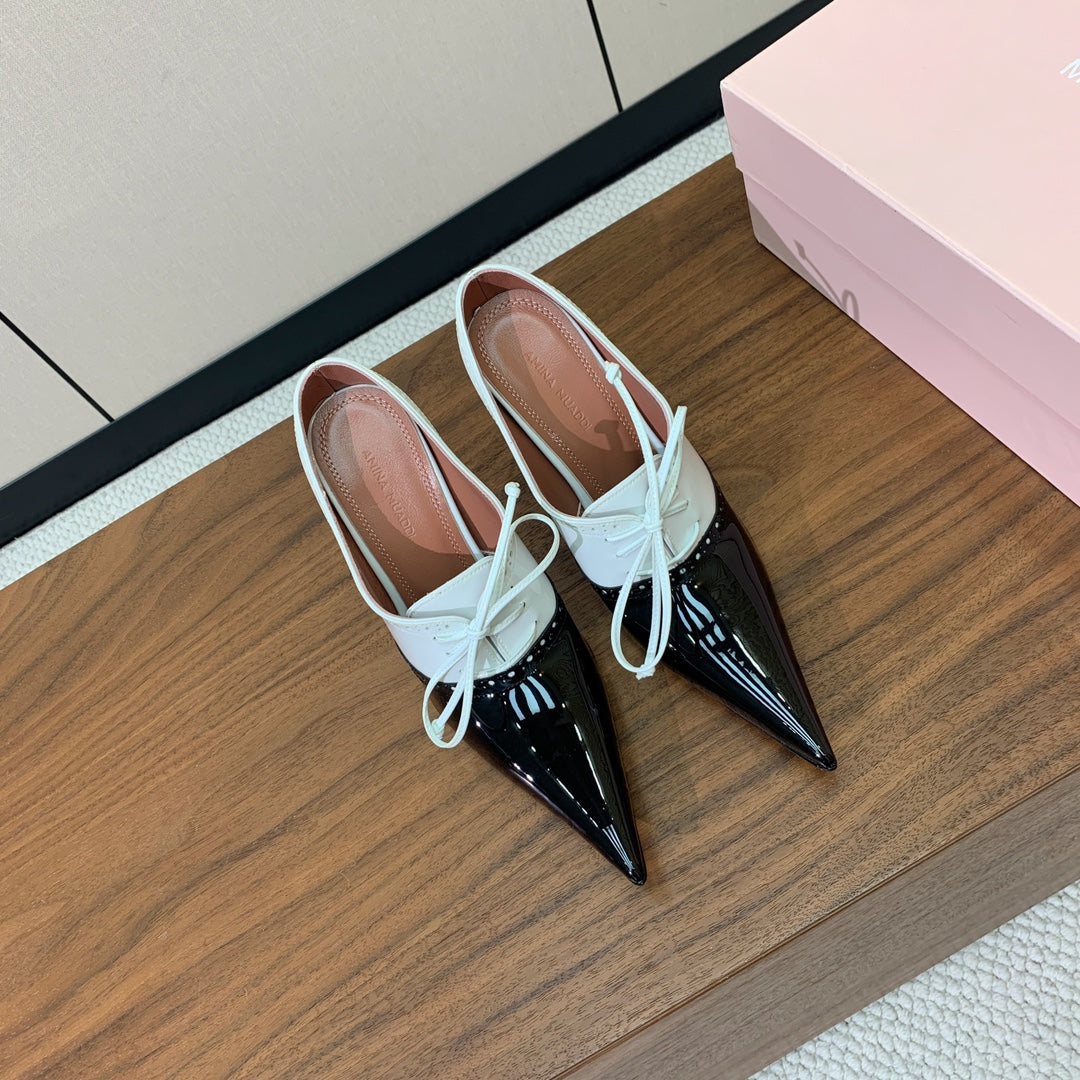 ALAIA 26S LACE-UP HEELED 105 MM IN BLACK AND WHITE GLOSSY CALFSKIN