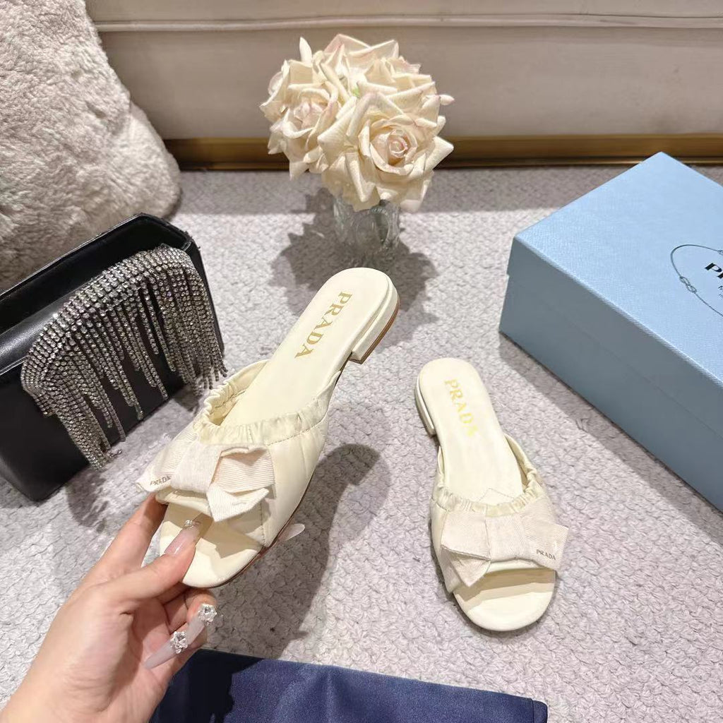 PRADA 26S RUCHED BOW SLIDE SANDALS IN IVORY WHITE CALFSKIN