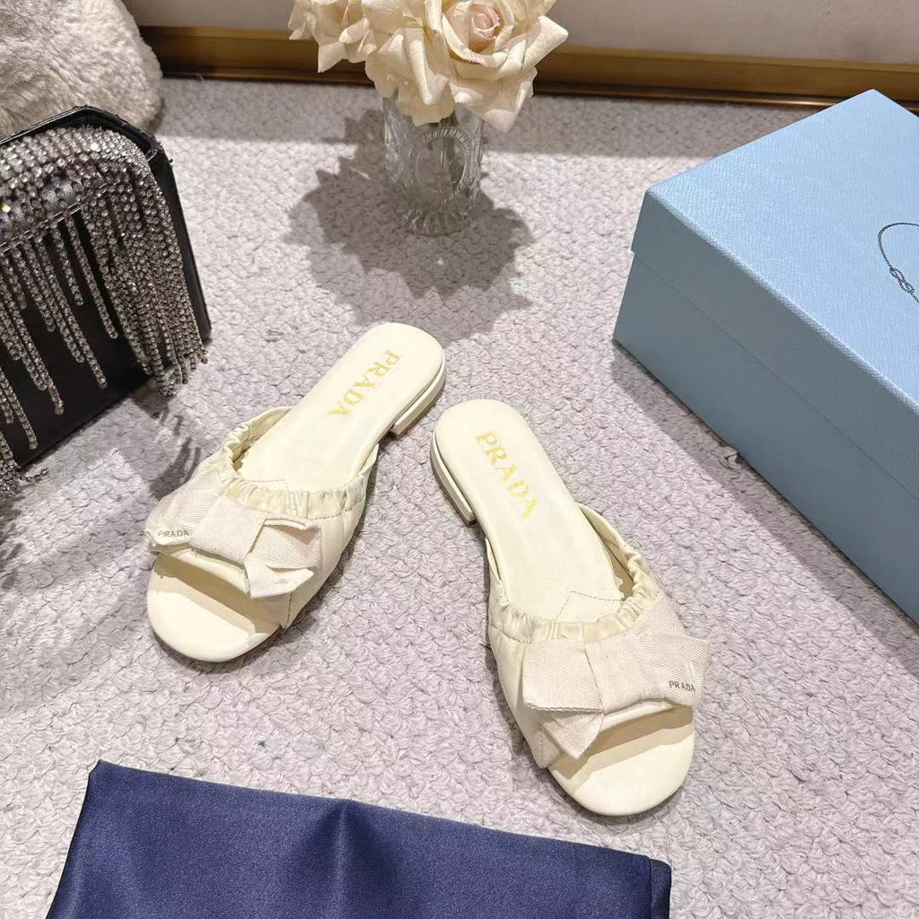 PRADA 26S RUCHED BOW SLIDE SANDALS IN IVORY WHITE CALFSKIN