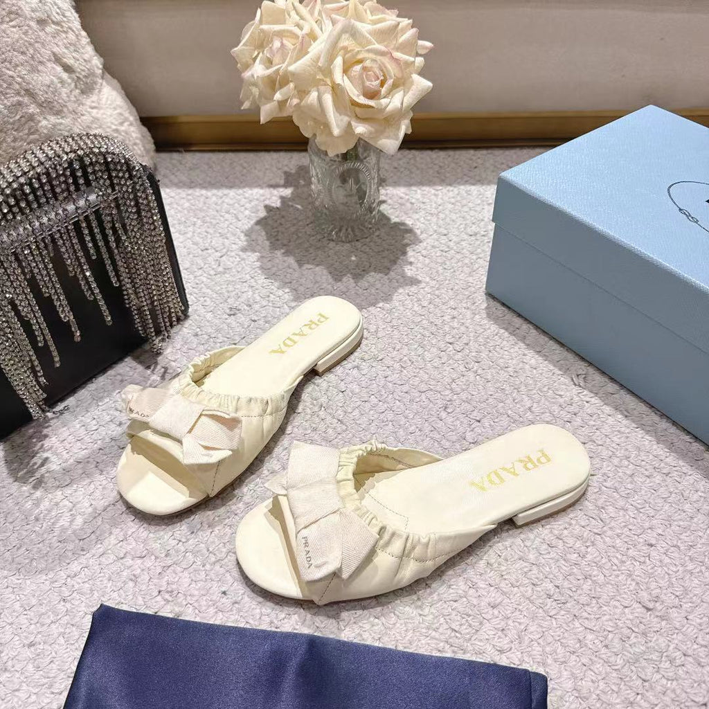PRADA 26S RUCHED BOW SLIDE SANDALS IN IVORY WHITE CALFSKIN
