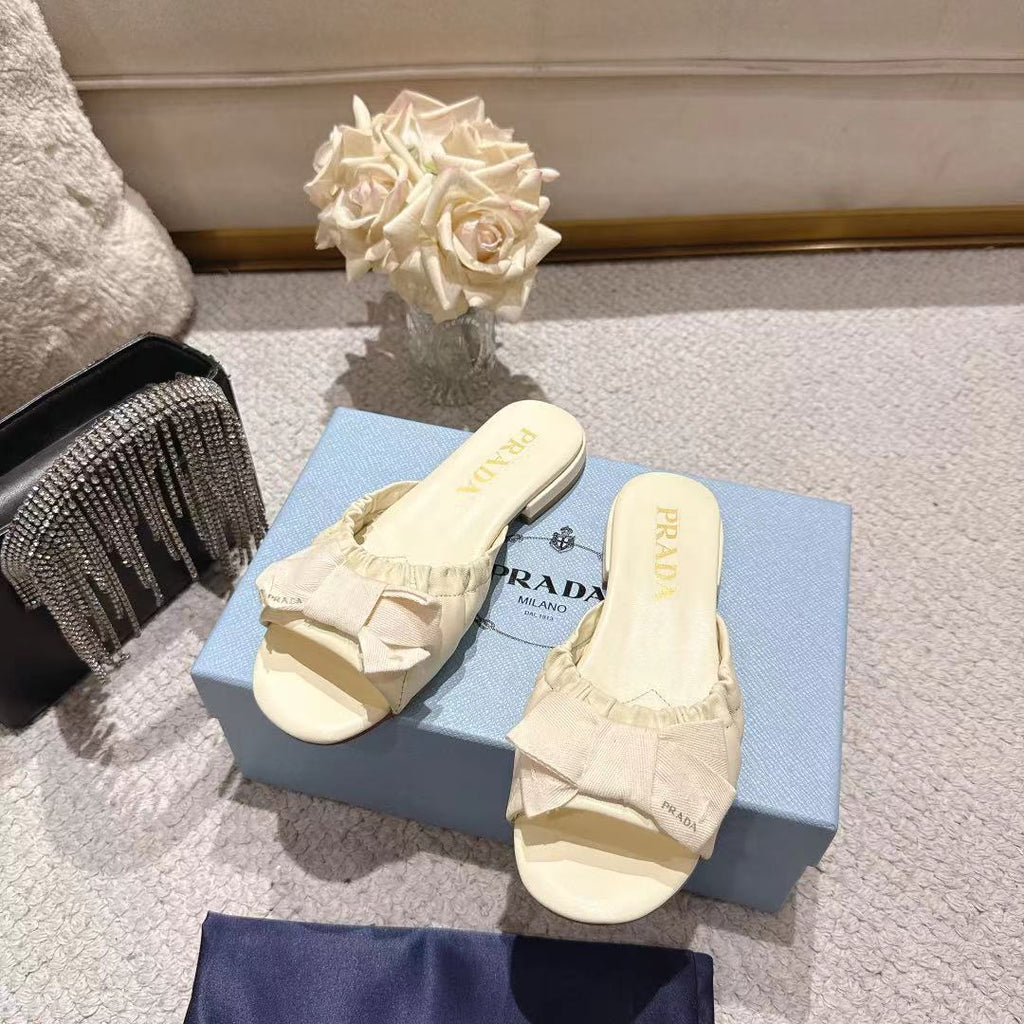 PRADA 26S RUCHED BOW SLIDE SANDALS IN IVORY WHITE CALFSKIN