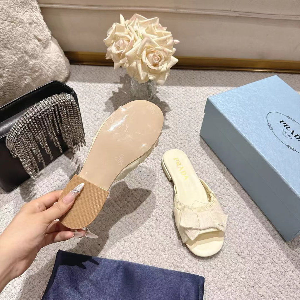 PRADA 26S RUCHED BOW SLIDE SANDALS IN IVORY WHITE CALFSKIN