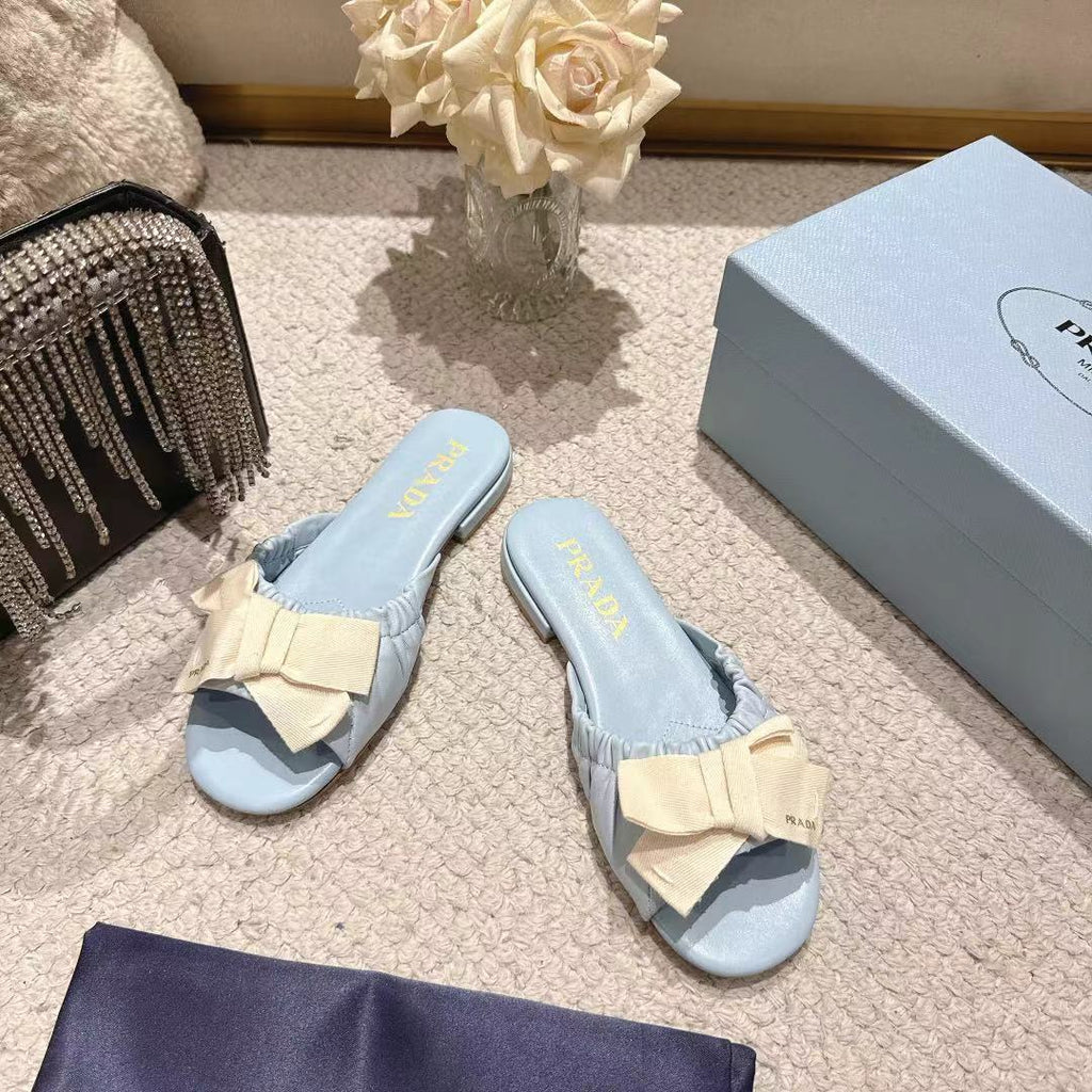 PRADA 26S RUCHED BOW SLIDE SANDALS IN LIGHT BLUE CALFSKIN