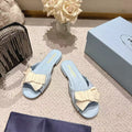 PRADA 26S RUCHED BOW SLIDE SANDALS IN LIGHT BLUE CALFSKIN