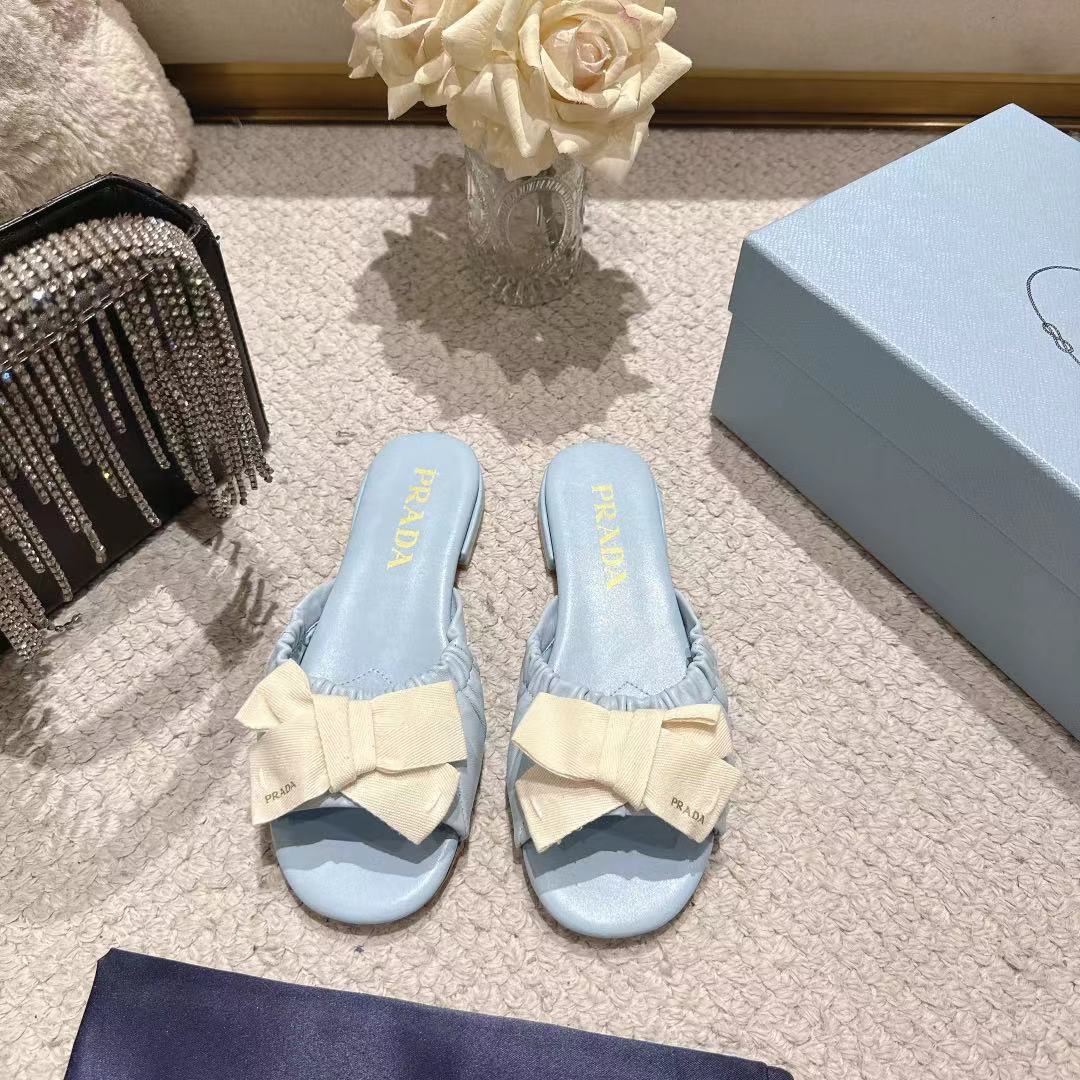 PRADA 26S RUCHED BOW SLIDE SANDALS IN LIGHT BLUE CALFSKIN