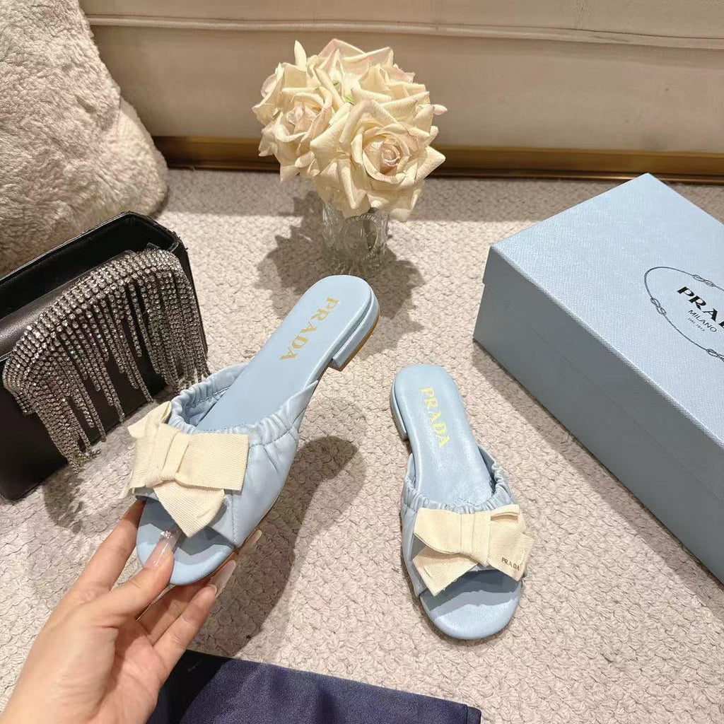 PRADA 26S RUCHED BOW SLIDE SANDALS IN LIGHT BLUE CALFSKIN