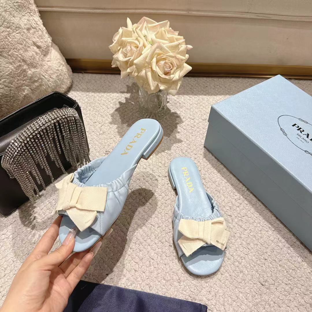 PRADA 26S RUCHED BOW SLIDE SANDALS IN LIGHT BLUE CALFSKIN