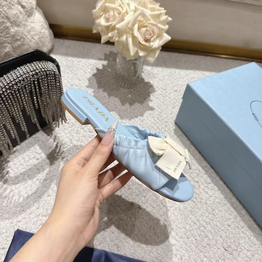 PRADA 26S RUCHED BOW SLIDE SANDALS IN LIGHT BLUE CALFSKIN