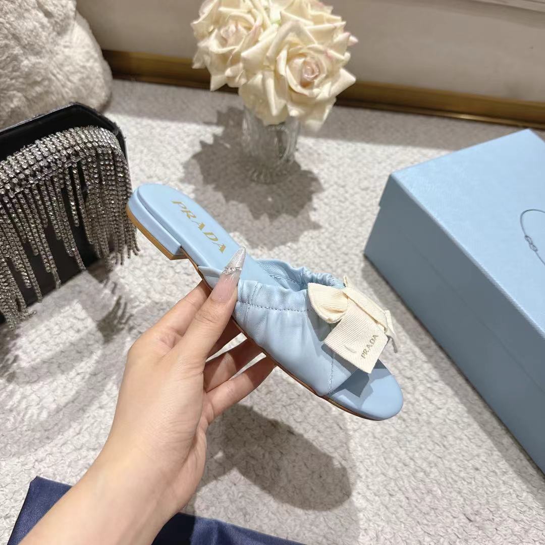 PRADA 26S RUCHED BOW SLIDE SANDALS IN LIGHT BLUE CALFSKIN