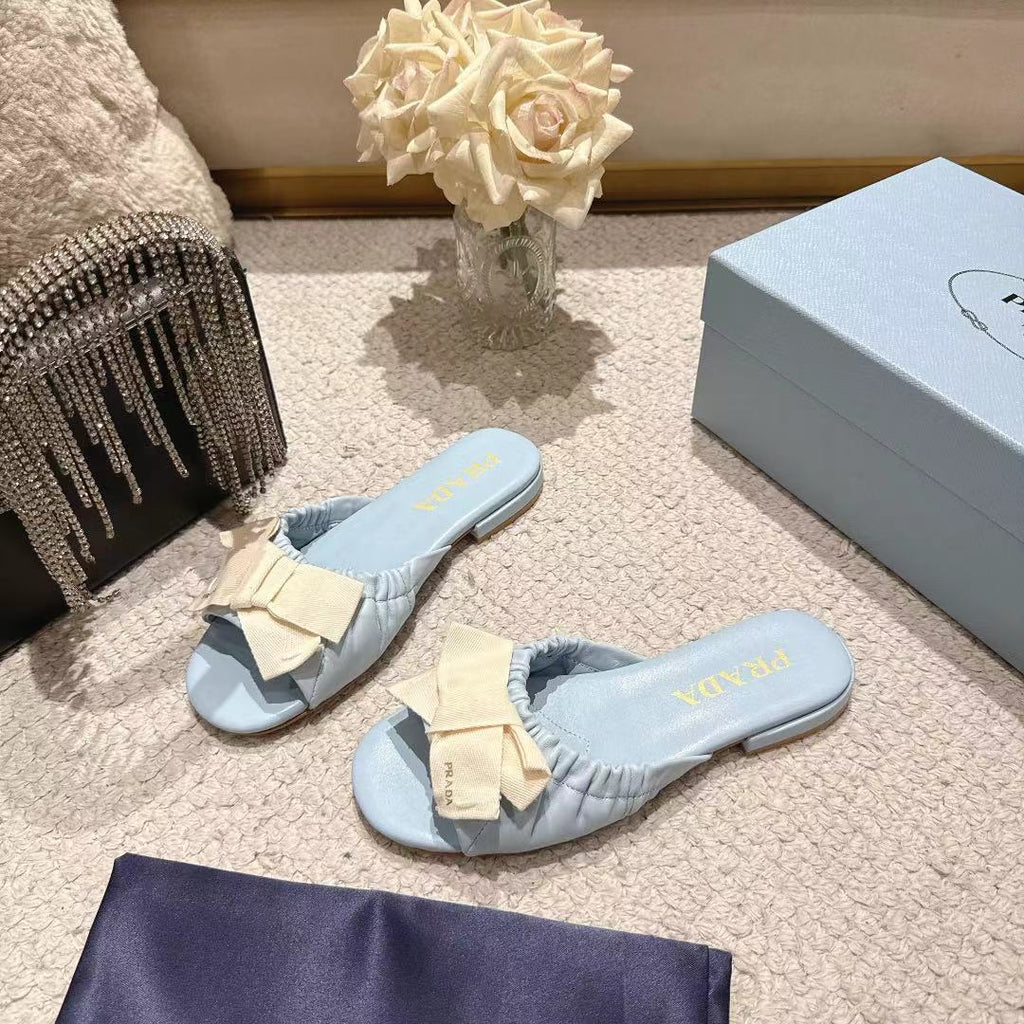 PRADA 26S RUCHED BOW SLIDE SANDALS IN LIGHT BLUE CALFSKIN