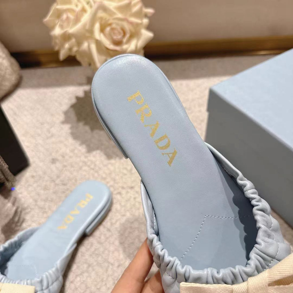 PRADA 26S RUCHED BOW SLIDE SANDALS IN LIGHT BLUE CALFSKIN