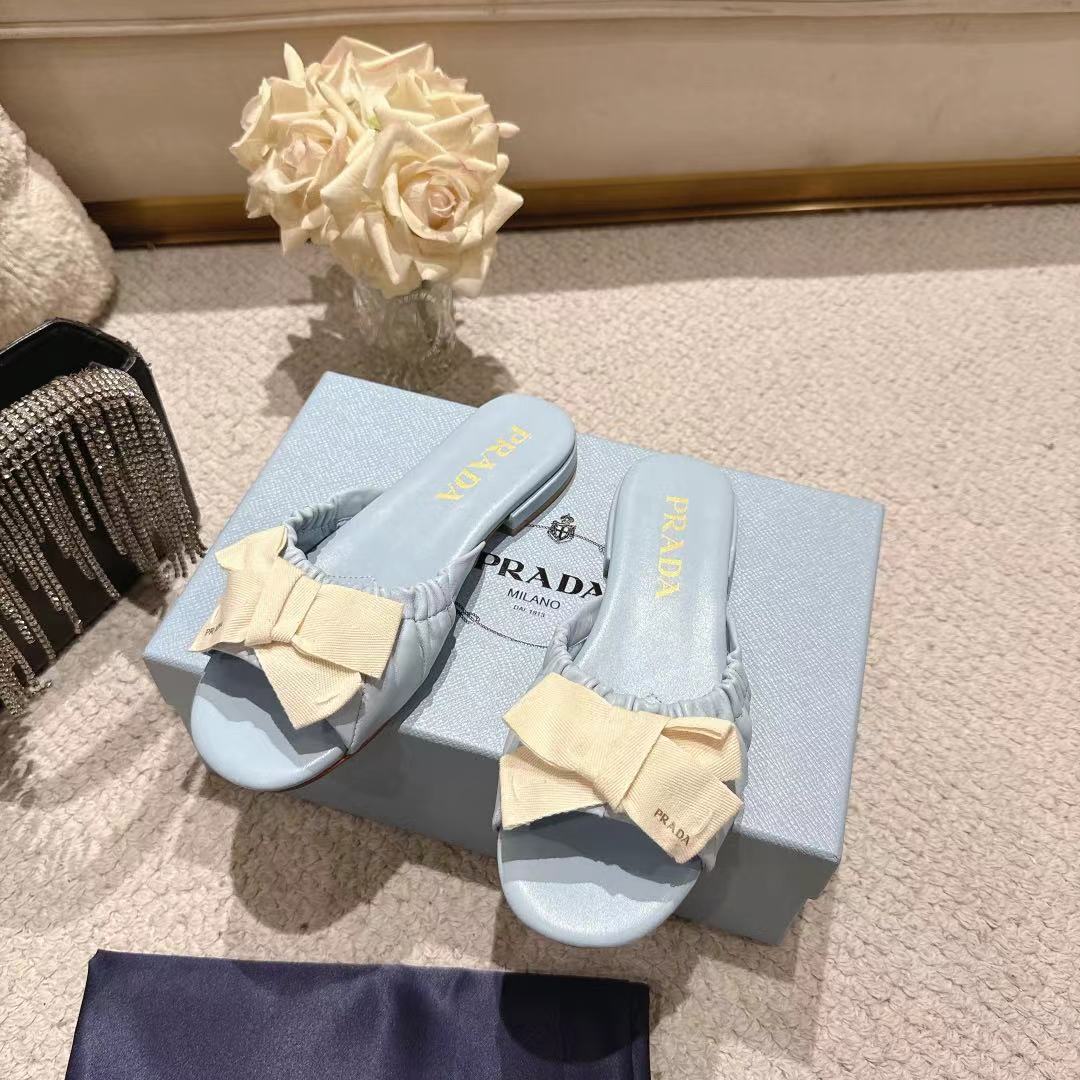 PRADA 26S RUCHED BOW SLIDE SANDALS IN LIGHT BLUE CALFSKIN