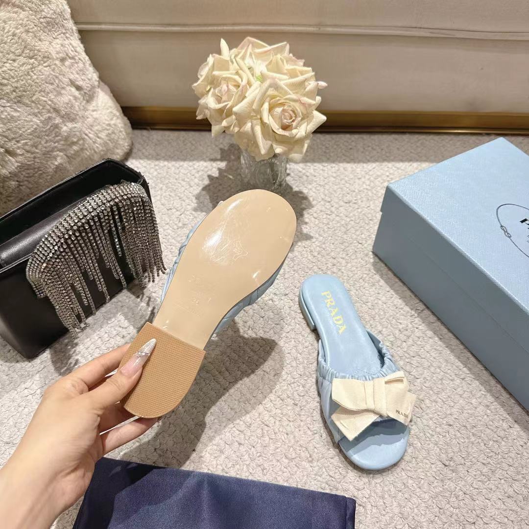 PRADA 26S RUCHED BOW SLIDE SANDALS IN LIGHT BLUE CALFSKIN