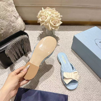 PRADA 26S RUCHED BOW SLIDE SANDALS IN LIGHT BLUE CALFSKIN