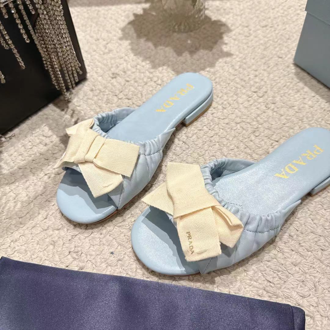 PRADA 26S RUCHED BOW SLIDE SANDALS IN LIGHT BLUE CALFSKIN