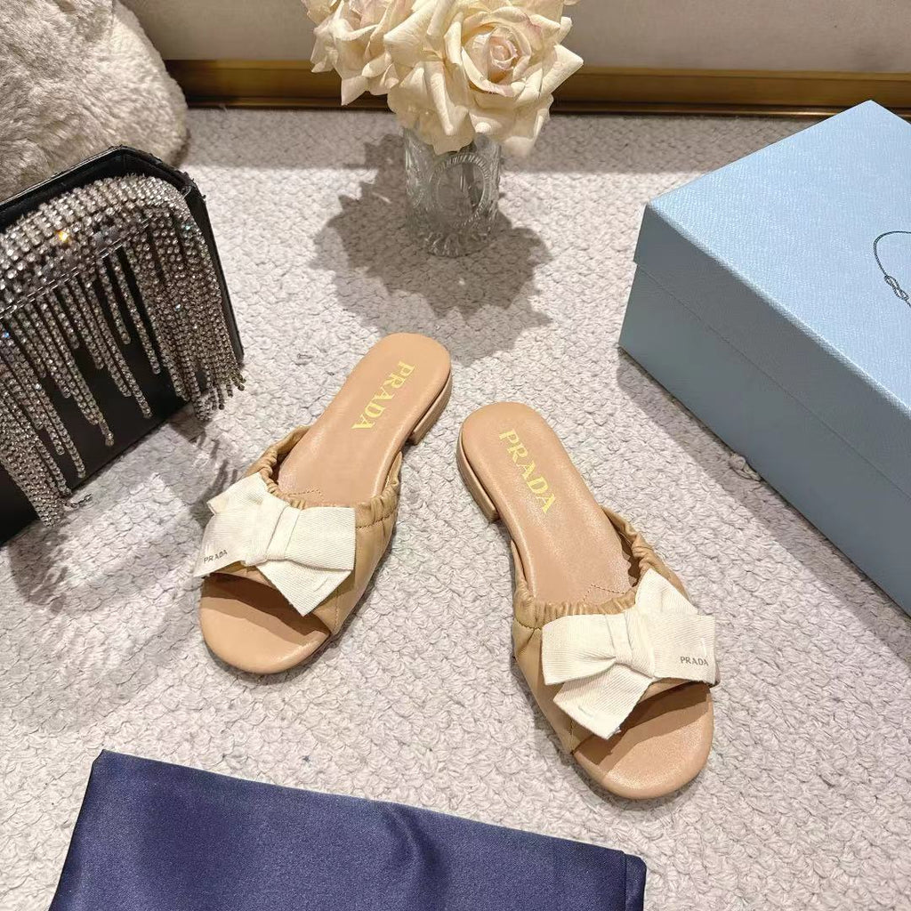 PRADA 26S RUCHED BOW SLIDE SANDALS IN BEIGE CALFSKIN