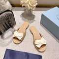 PRADA 26S RUCHED BOW SLIDE SANDALS IN BEIGE CALFSKIN