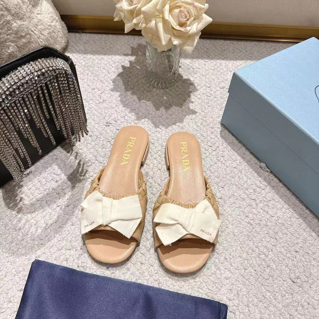 PRADA 26S RUCHED BOW SLIDE SANDALS IN BEIGE CALFSKIN