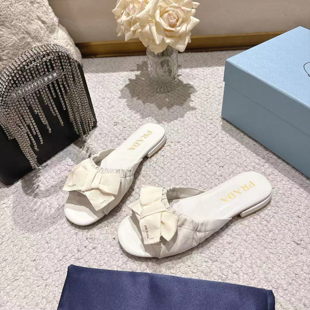 PRADA 26S RUCHED BOW SLIDE SANDALS IN CREAM WHITE CALFSKIN