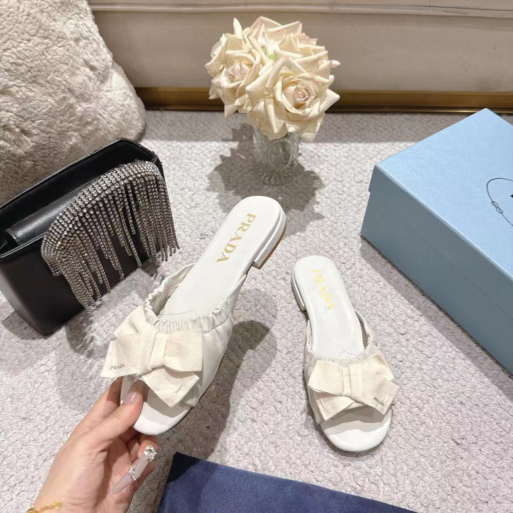 PRADA 26S RUCHED BOW SLIDE SANDALS IN CREAM WHITE CALFSKIN
