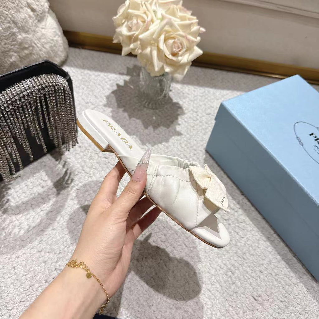 PRADA 26S RUCHED BOW SLIDE SANDALS IN CREAM WHITE CALFSKIN