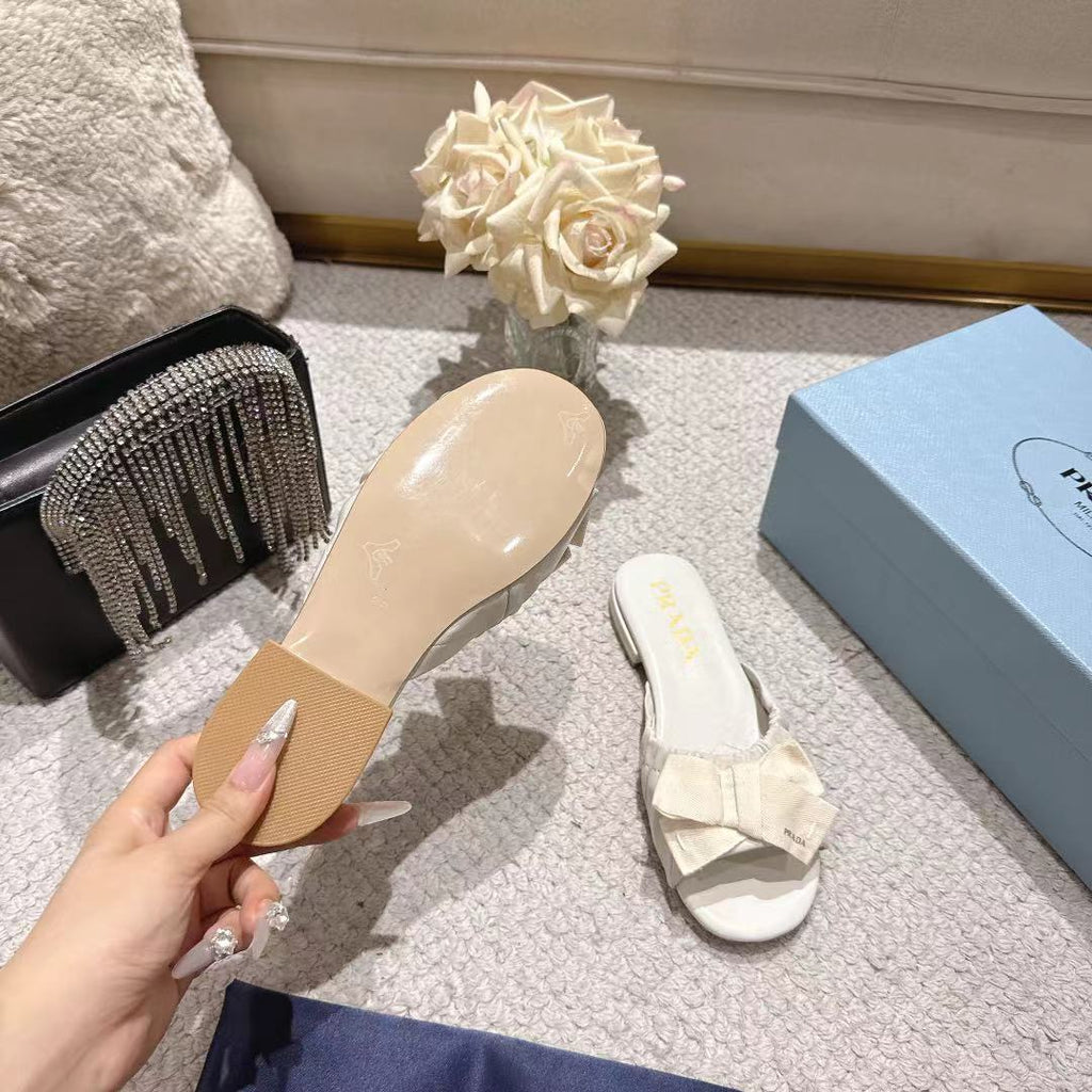 PRADA 26S RUCHED BOW SLIDE SANDALS IN CREAM WHITE CALFSKIN