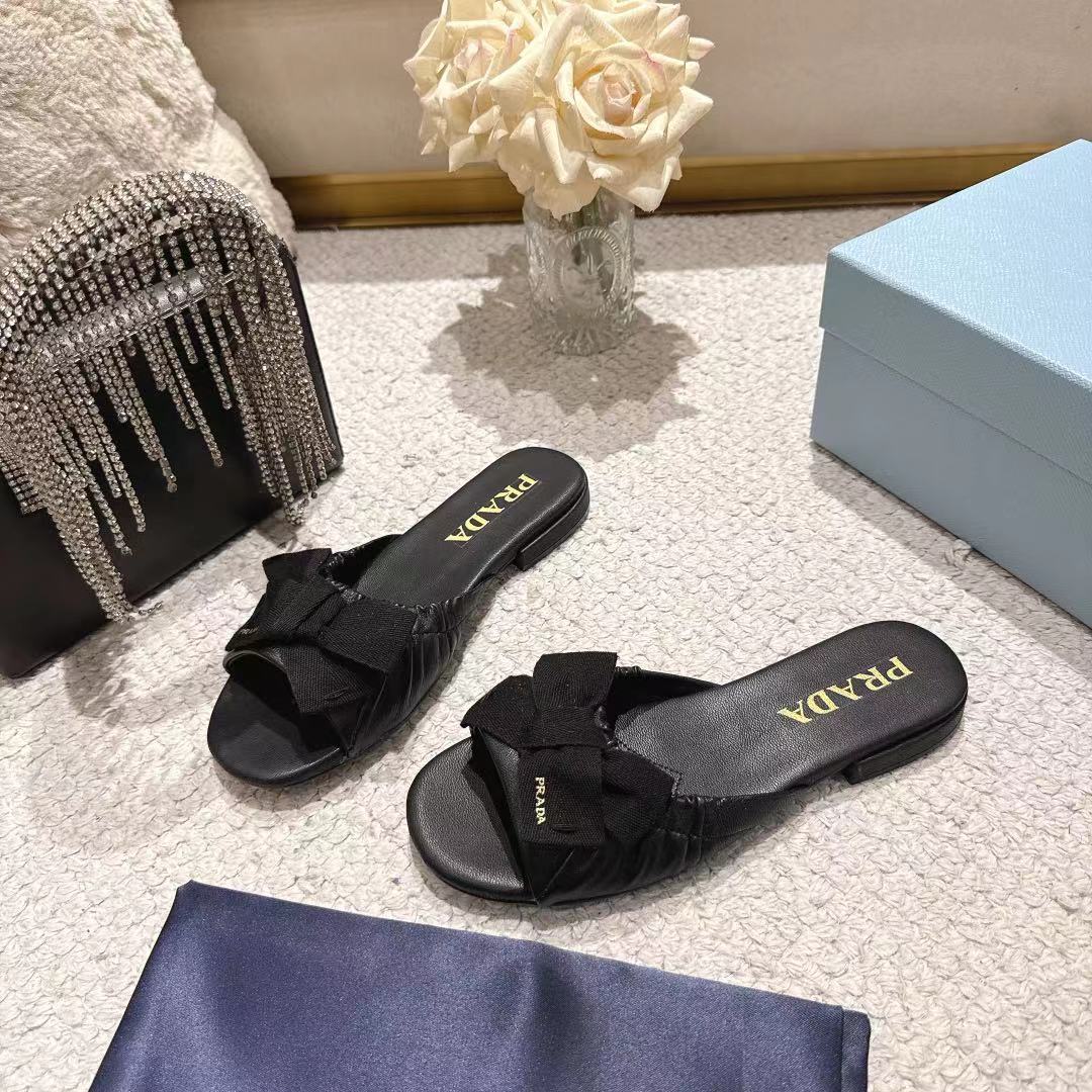 PRADA 26S RUCHED BOW SLIDE SANDALS IN BLACK CALFSKIN