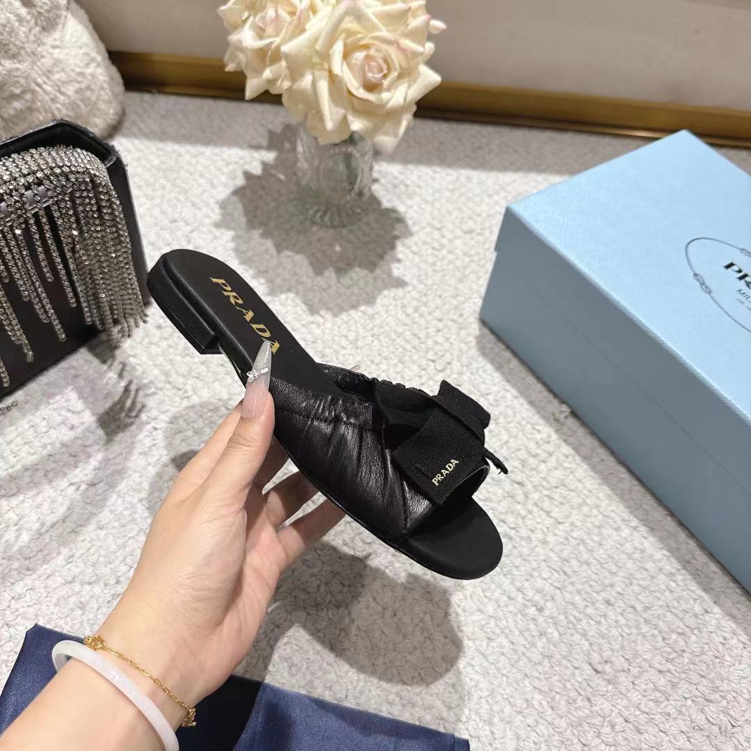 PRADA 26S RUCHED BOW SLIDE SANDALS IN BLACK CALFSKIN