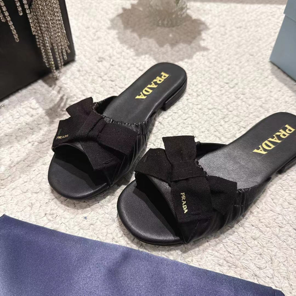 PRADA 26S RUCHED BOW SLIDE SANDALS IN BLACK CALFSKIN