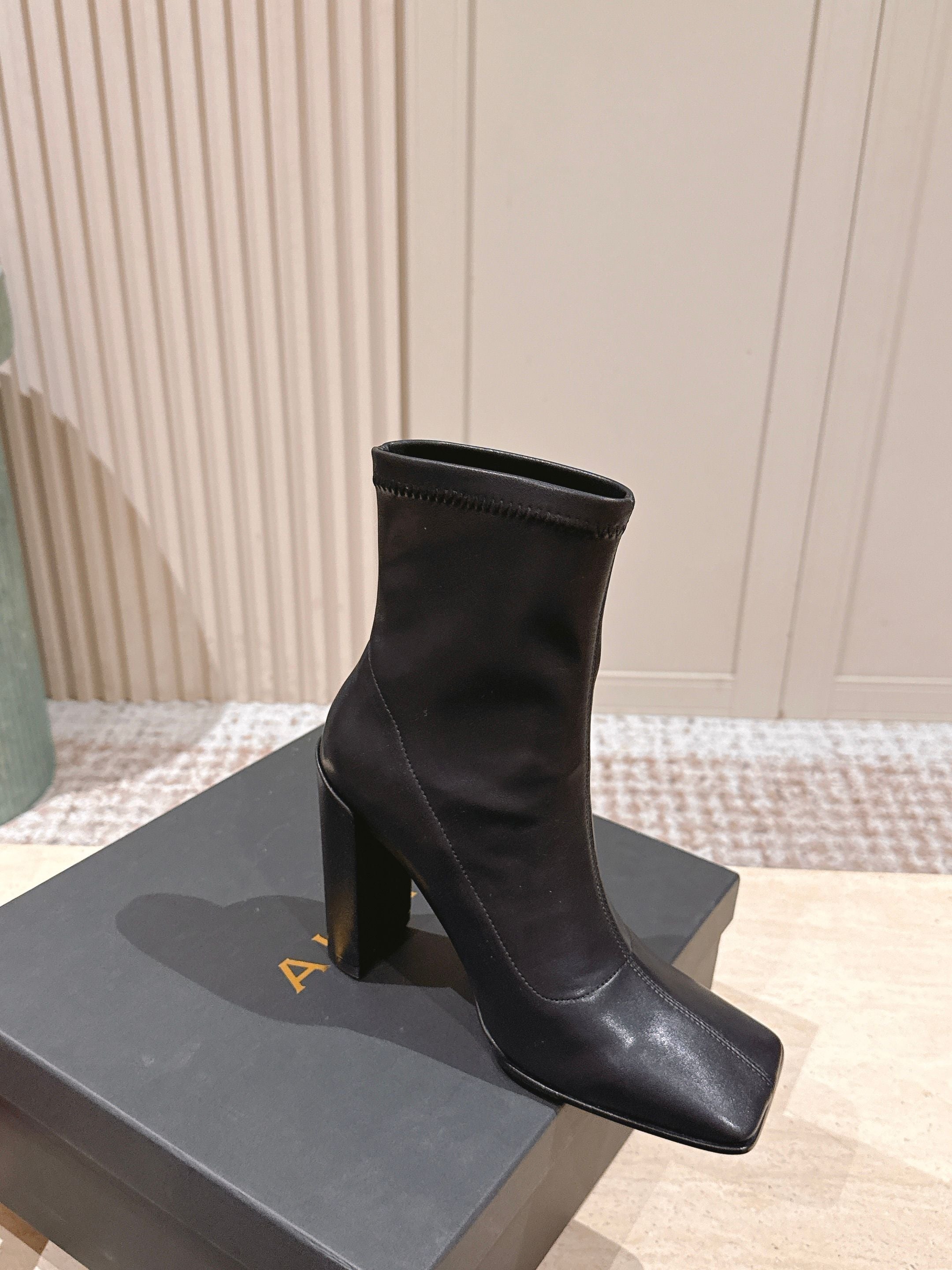 ALAIA 26S HEELED BOOTS 90 MM IN BLACK CALFSKIN