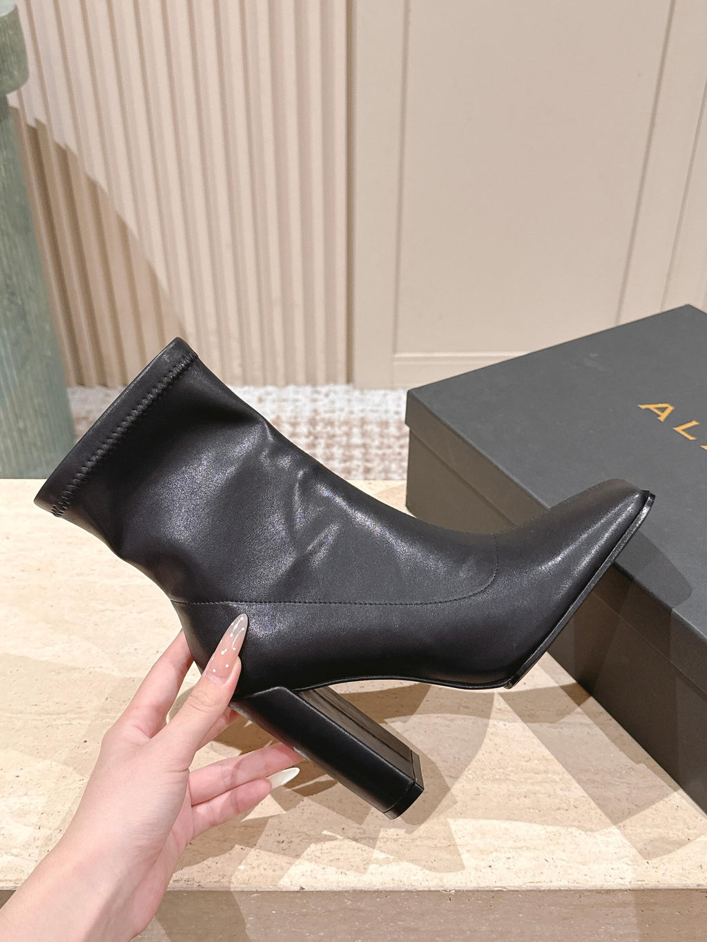 ALAIA 26S HEELED BOOTS 90 MM IN BLACK CALFSKIN