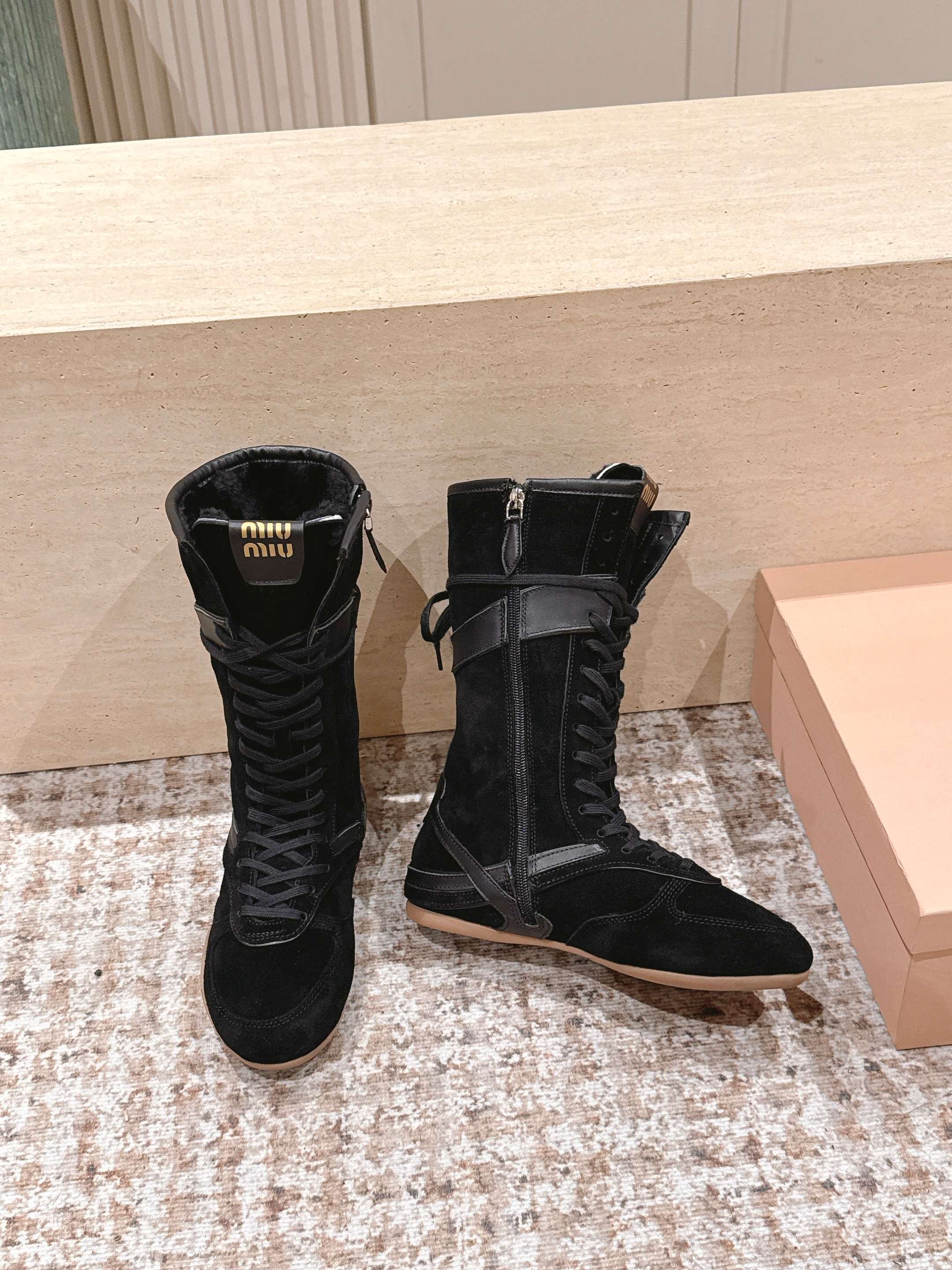MIUMIU 25S ANKLE BOOTS IN BLACK SUEDE WITH SHEARLING