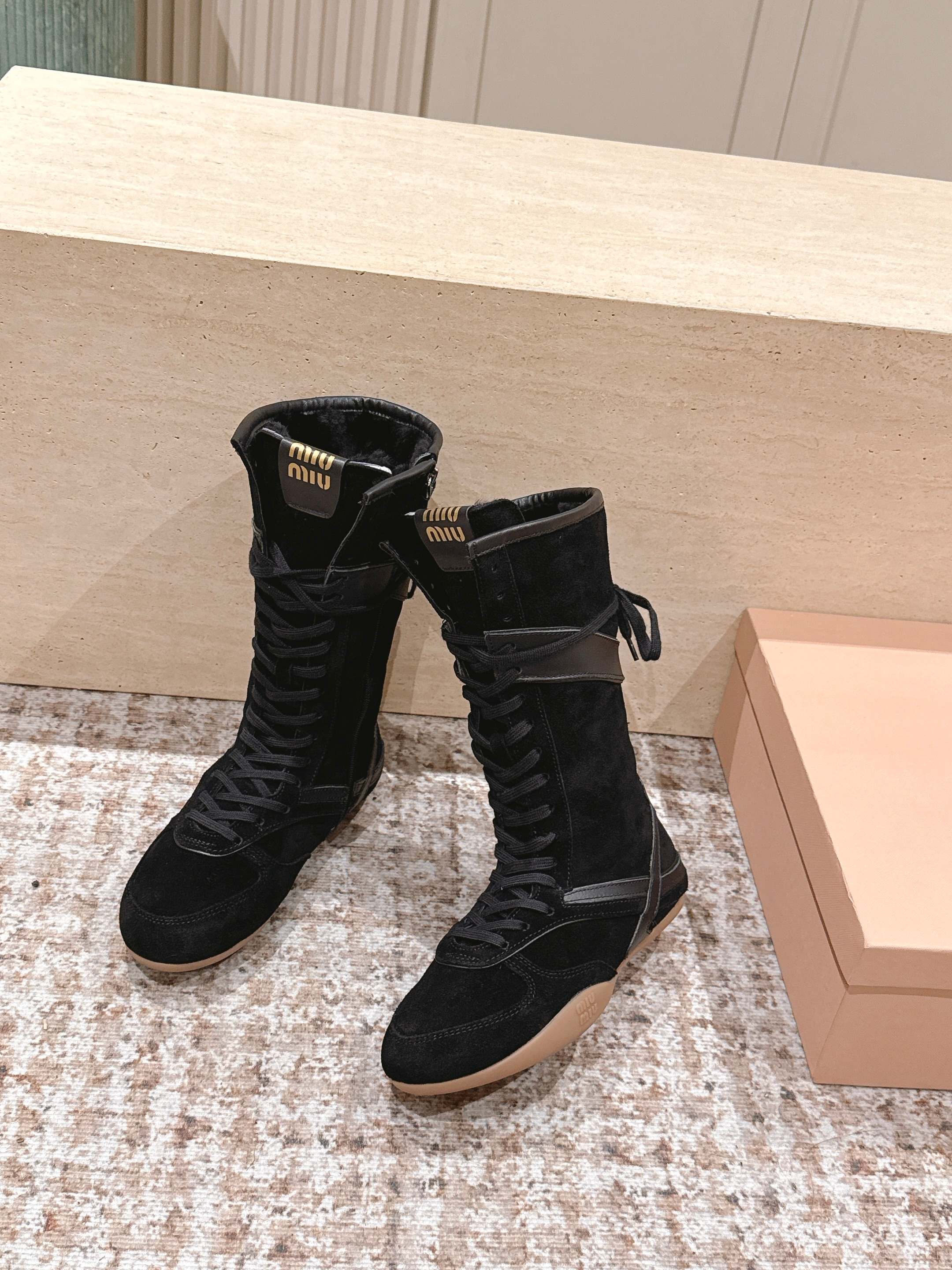 MIUMIU 25S ANKLE BOOTS IN BLACK SUEDE WITH SHEARLING