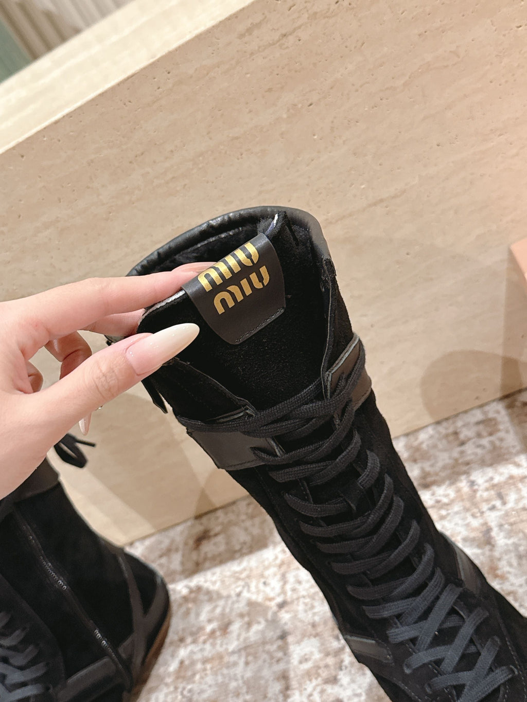 MIUMIU 25S ANKLE BOOTS IN BLACK SUEDE WITH SHEARLING