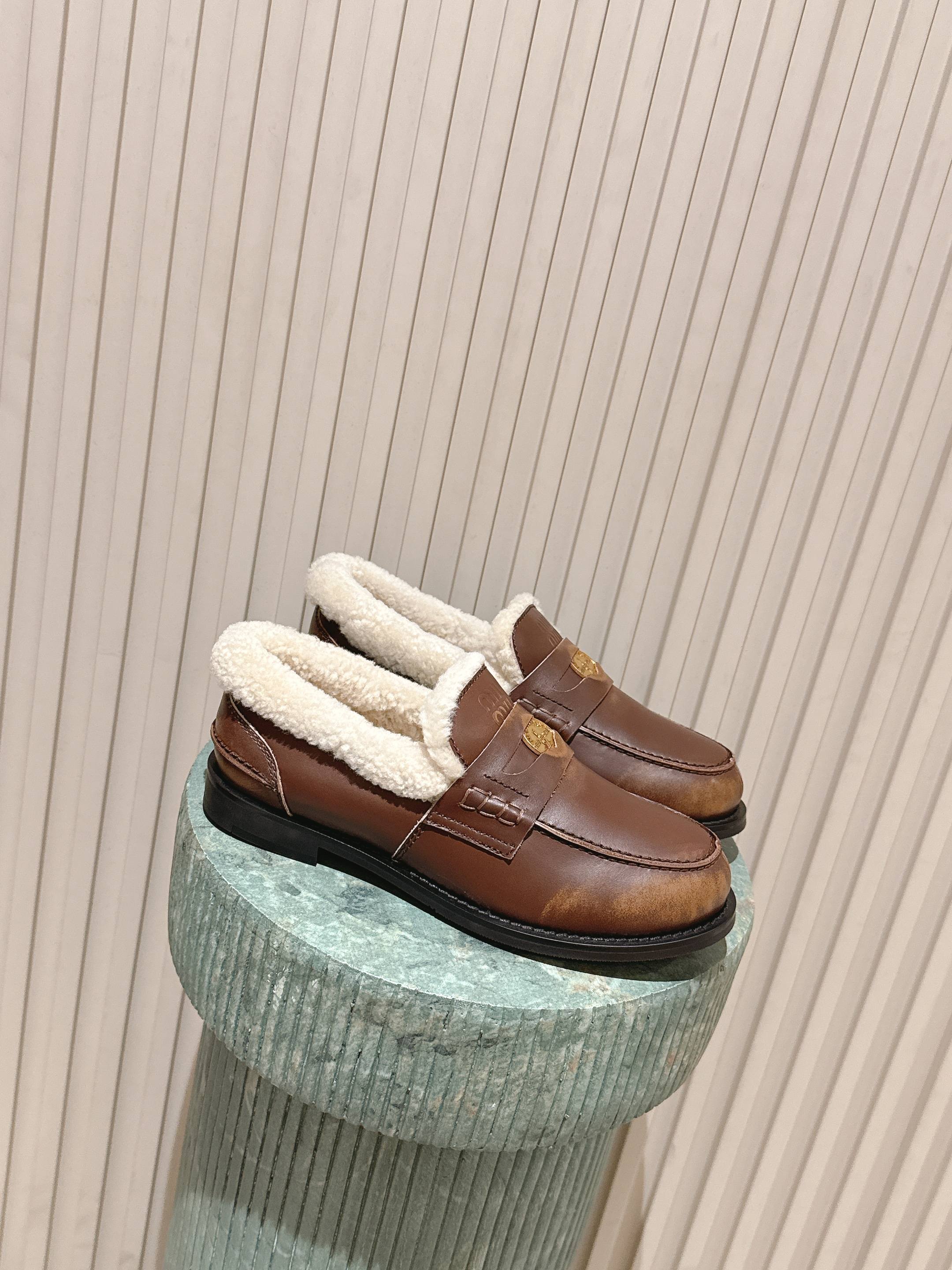 MIUMIU 25S PENNY LOAFERS 20MM IN EBONY BROWN BLEACHED CALFSKIN WITH SHEARLING
