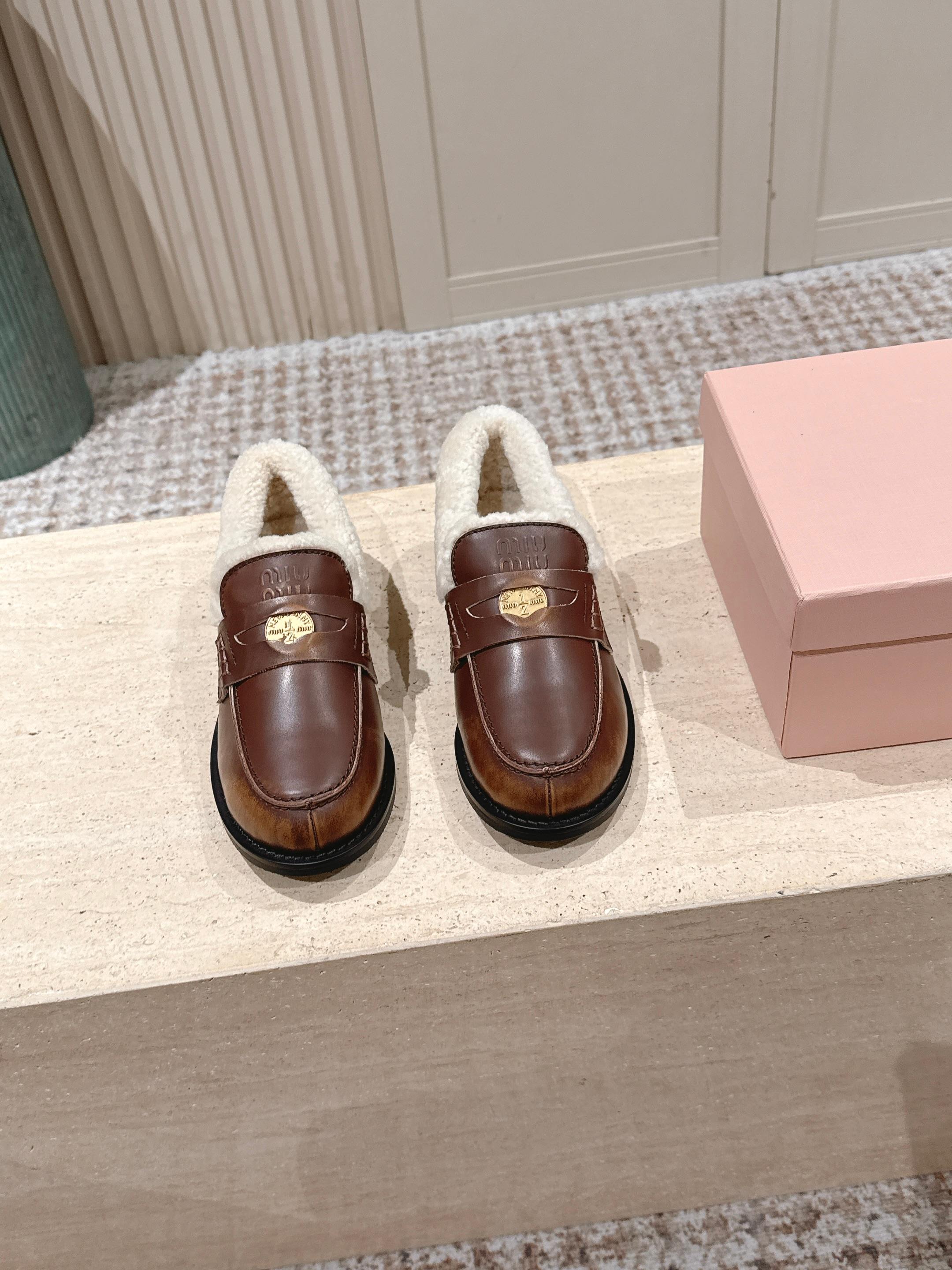 MIUMIU 25S PENNY LOAFERS 20MM IN EBONY BROWN BLEACHED CALFSKIN WITH SHEARLING