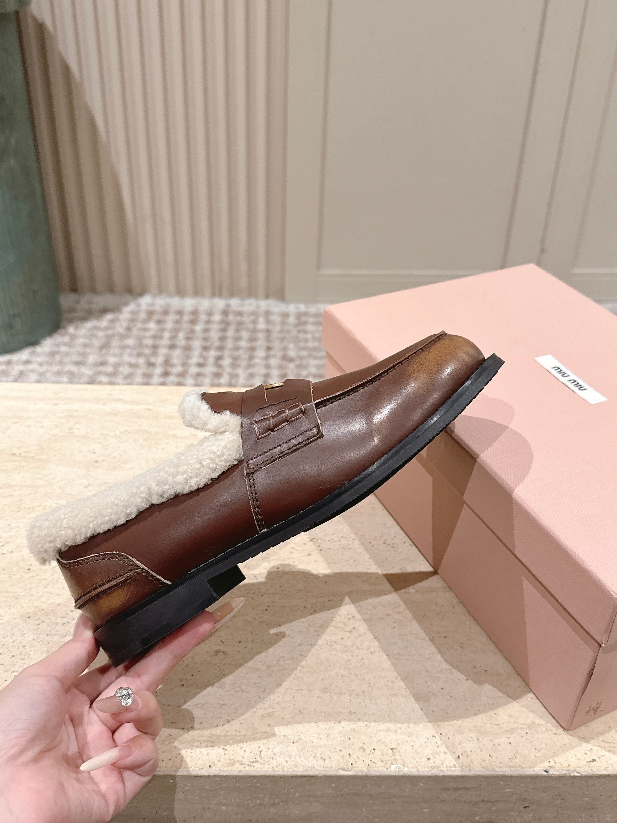 MIUMIU 25S PENNY LOAFERS 20MM IN EBONY BROWN BLEACHED CALFSKIN WITH SHEARLING