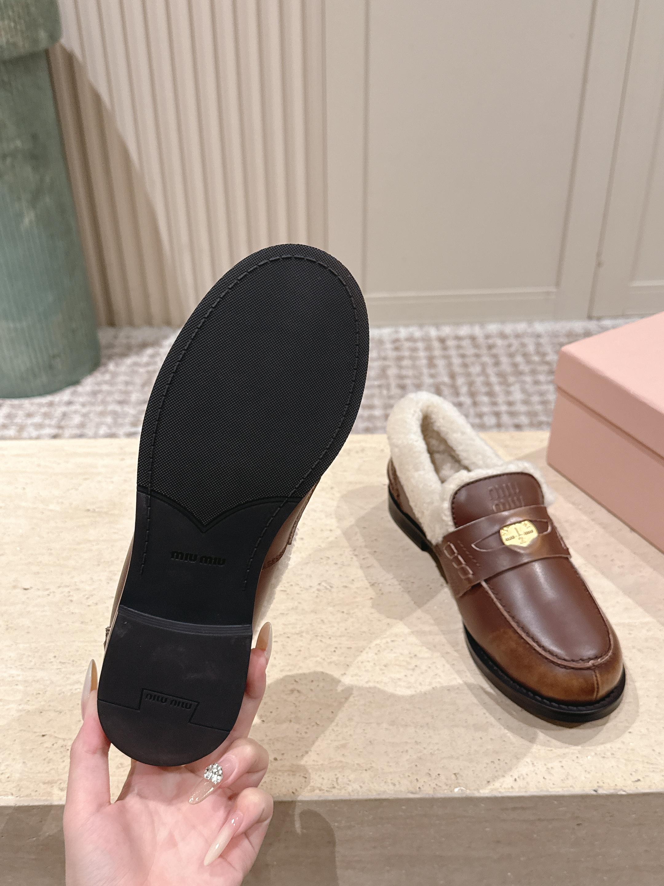 MIUMIU 25S PENNY LOAFERS 20MM IN EBONY BROWN BLEACHED CALFSKIN WITH SHEARLING